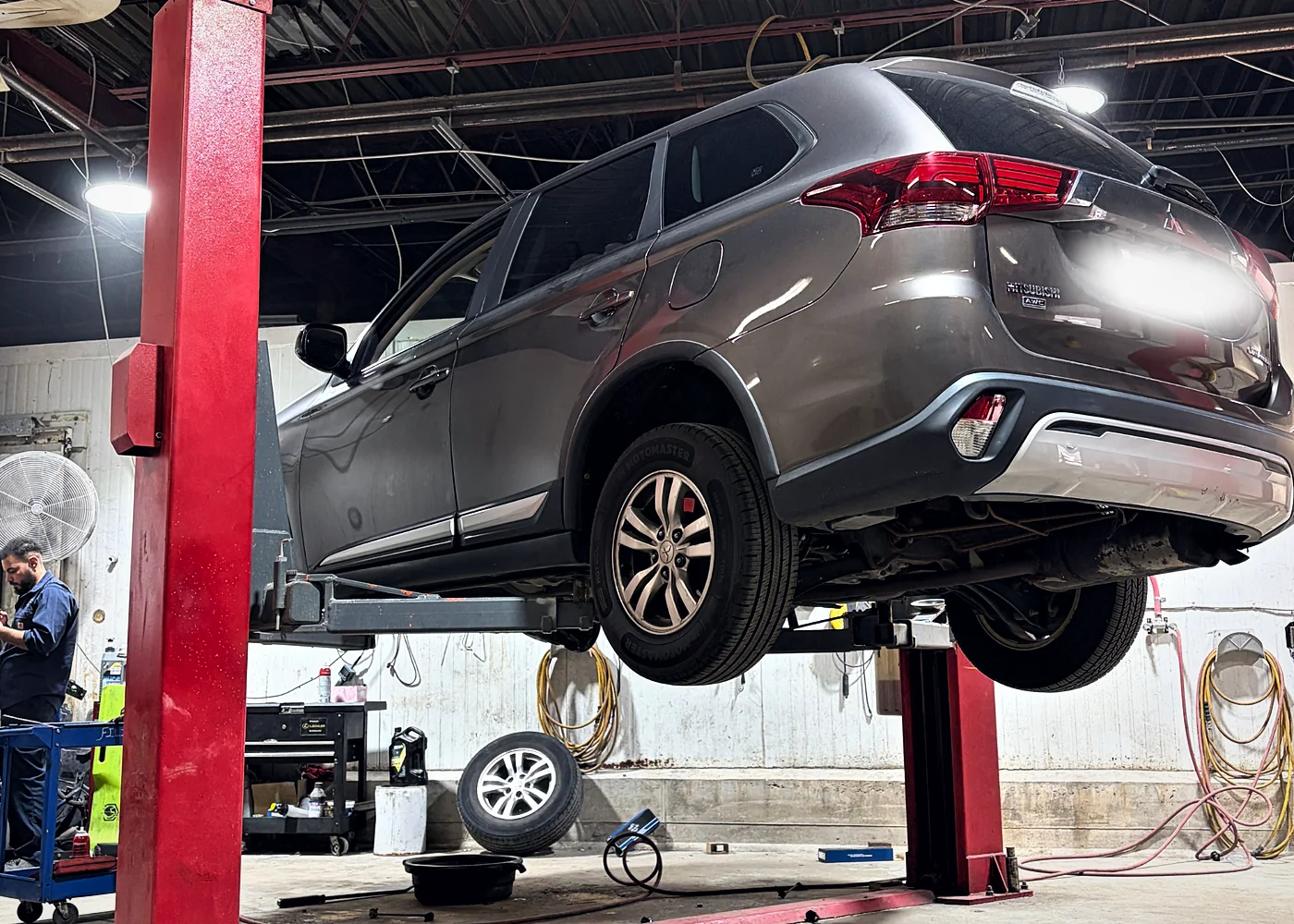 A vehicle raised on the lift