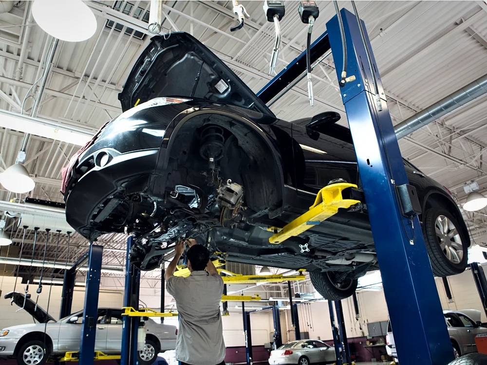 A vehicle raised for collision and structural repair